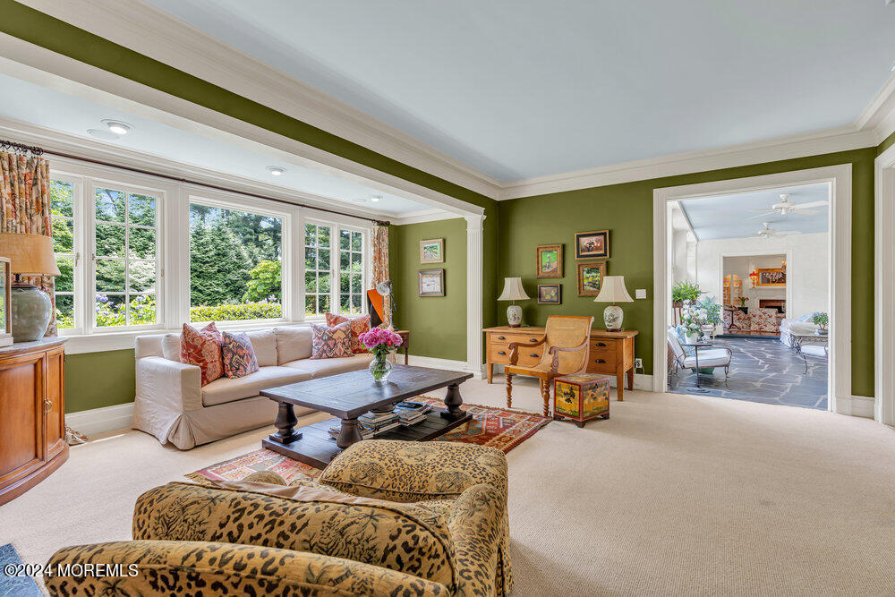 16 Buttonwood Lane Rumson, NJ 07760 - Photo 17 of 48 a living room with furniture and large windows
