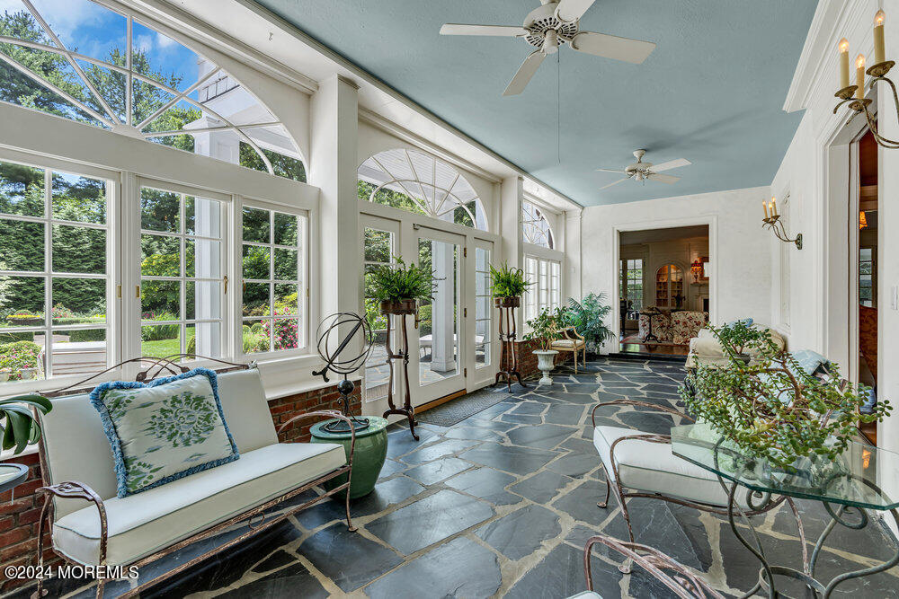 16 Buttonwood Lane Rumson, NJ 07760 - Photo 18 of 48 a living room with furniture and a large window