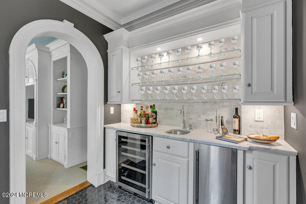 16 Buttonwood Lane Rumson, NJ 07760 - Photo 19 of 48 a kitchen with stainless steel appliances a sink and cabinets
