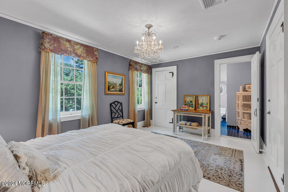 16 Buttonwood Lane Rumson, NJ 07760 - Photo 43 of 48 a bedroom with a bed and a flat tv screen on dresser