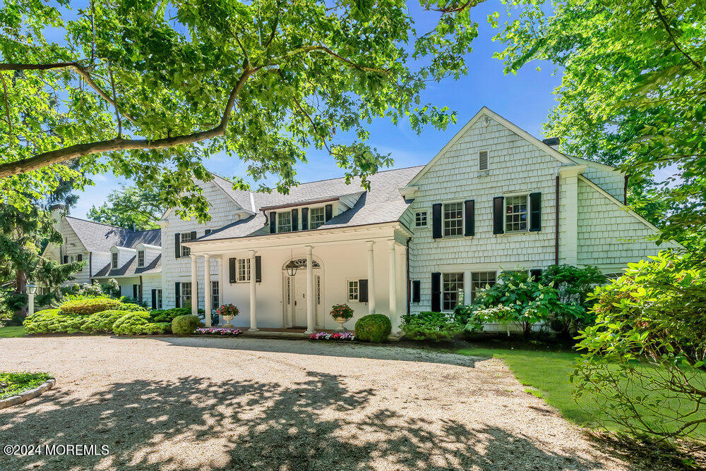 16 Buttonwood Lane Rumson, NJ 07760 - Photo 48 of 48 front view of a house with a yard