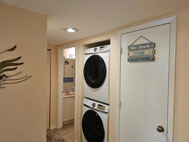 a bedroom with two beds and painting on the wall