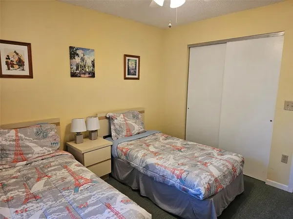 a bedroom with a bed and a table in it