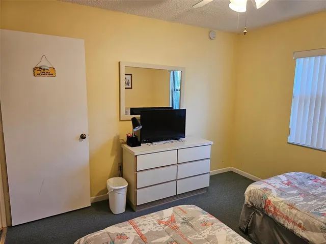 a bathroom with a shower curtain and a sink
