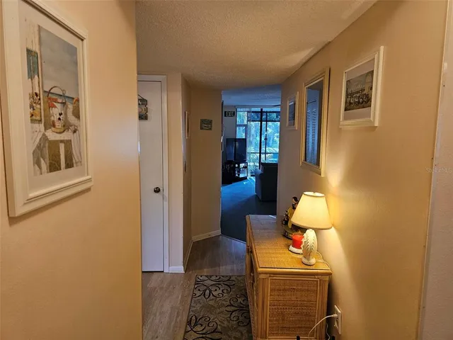 a kitchen with granite countertop a stove and a refrigerator