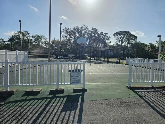 a front view of a building and trees