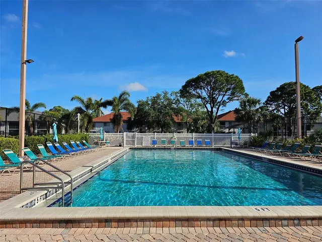 a view of a backyard with sitting area