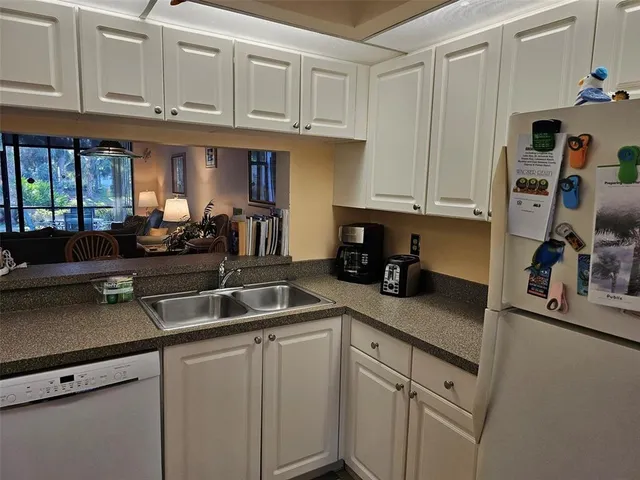 a kitchen with stainless steel appliances granite countertop a stove and a cabinets