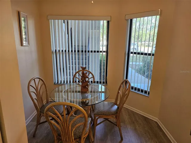a living room with couches a coffee table and a flat screen tv