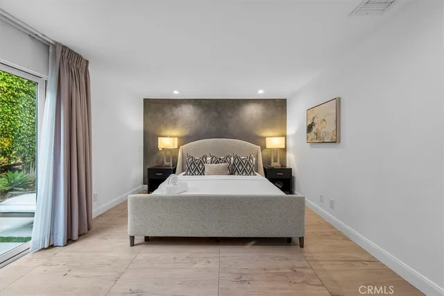 a bedroom with a bed and window