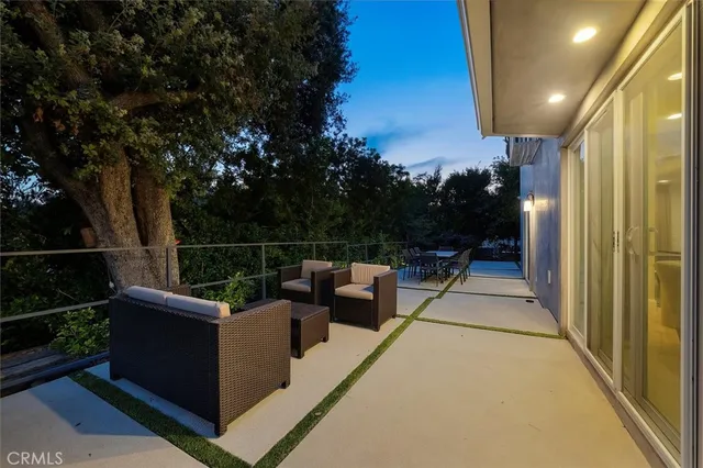 a view of roof deck with furniture