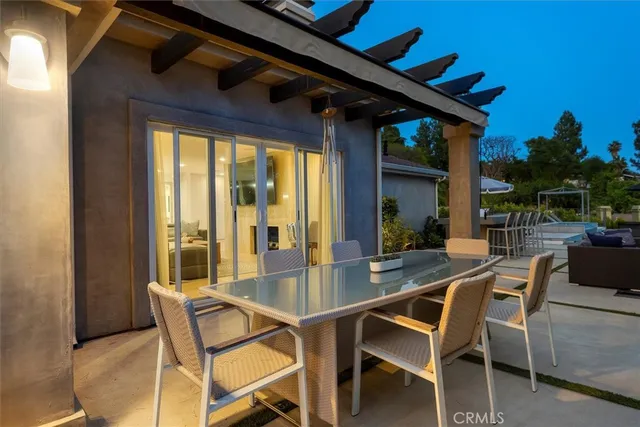 a view of a dining room with furniture and front door