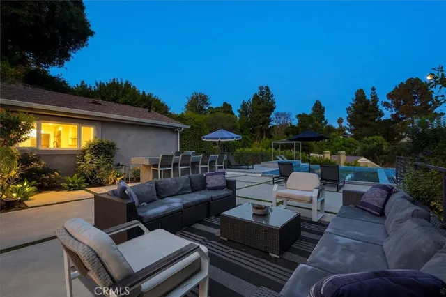 a outdoor living space with furniture and city view