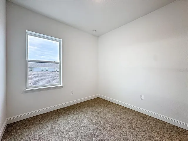 a bathroom with a sink vanity mirror and toilet