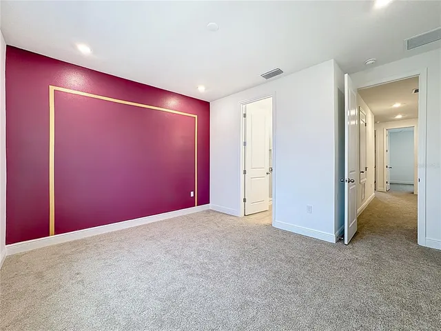 a bathroom with a sink double vanity granite and a mirror