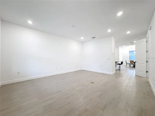 a view of an empty room with a window