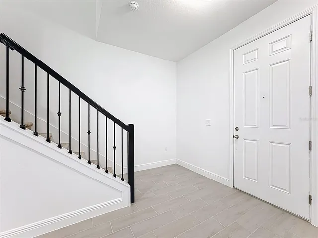 a kitchen with stainless steel appliances a stove a sink a microwave a refrigerator and cabinets