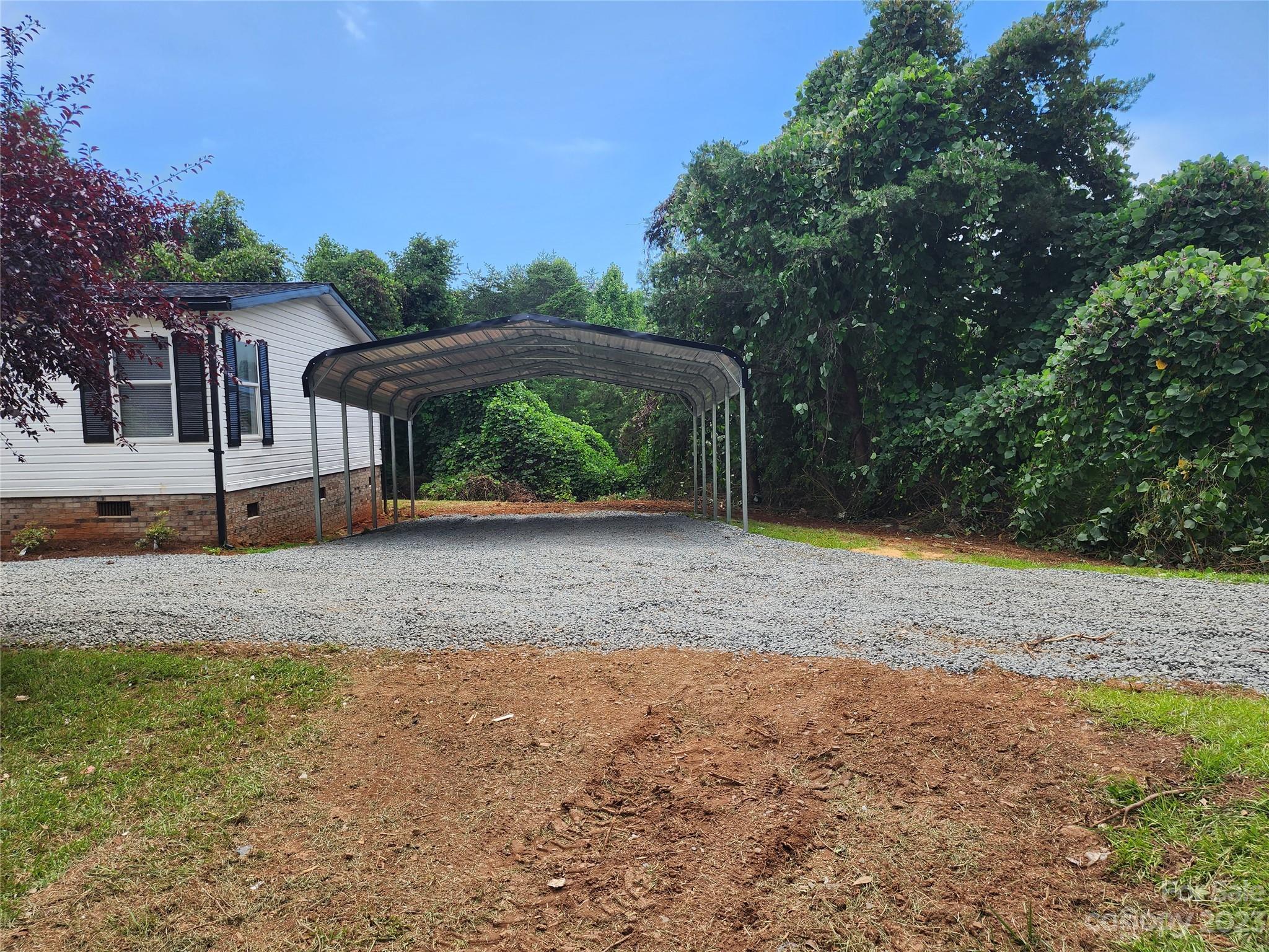 415 Maple Creek Road Rutherfordton, NC 28139 - Photo 2 of 10 a view of a house with backyard and trees
