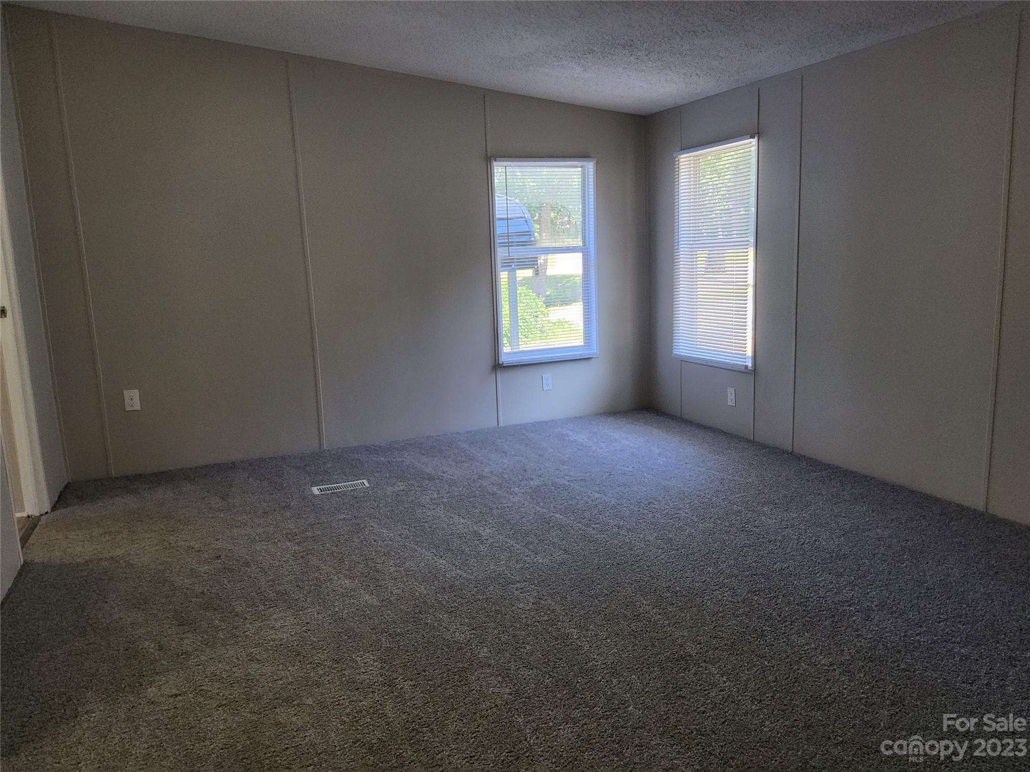 415 Maple Creek Road Rutherfordton, NC 28139 - Photo 7 of 10 an empty room that has a window in it