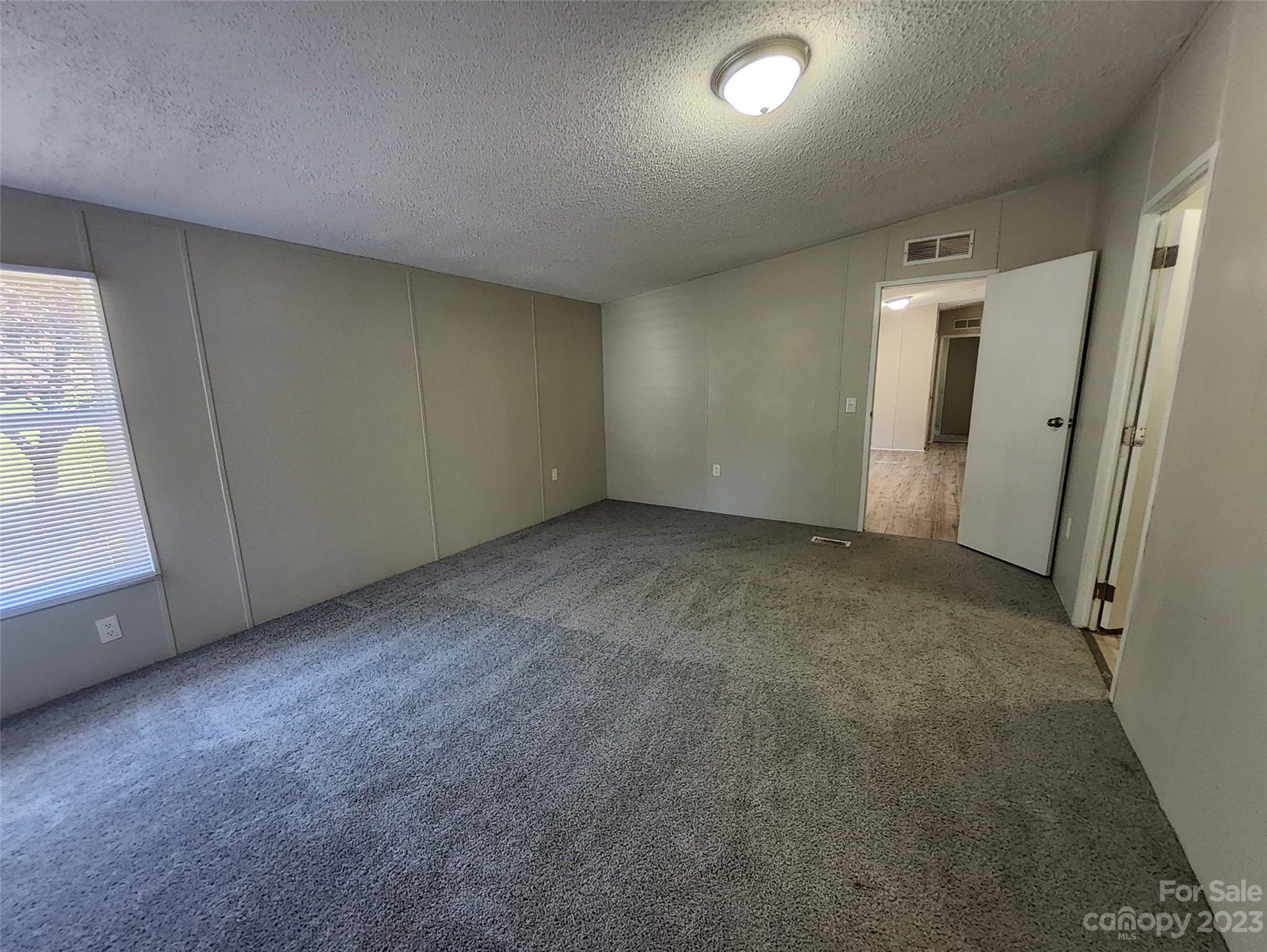 415 Maple Creek Road Rutherfordton, NC 28139 - Photo 8 of 10 an empty room with windows
