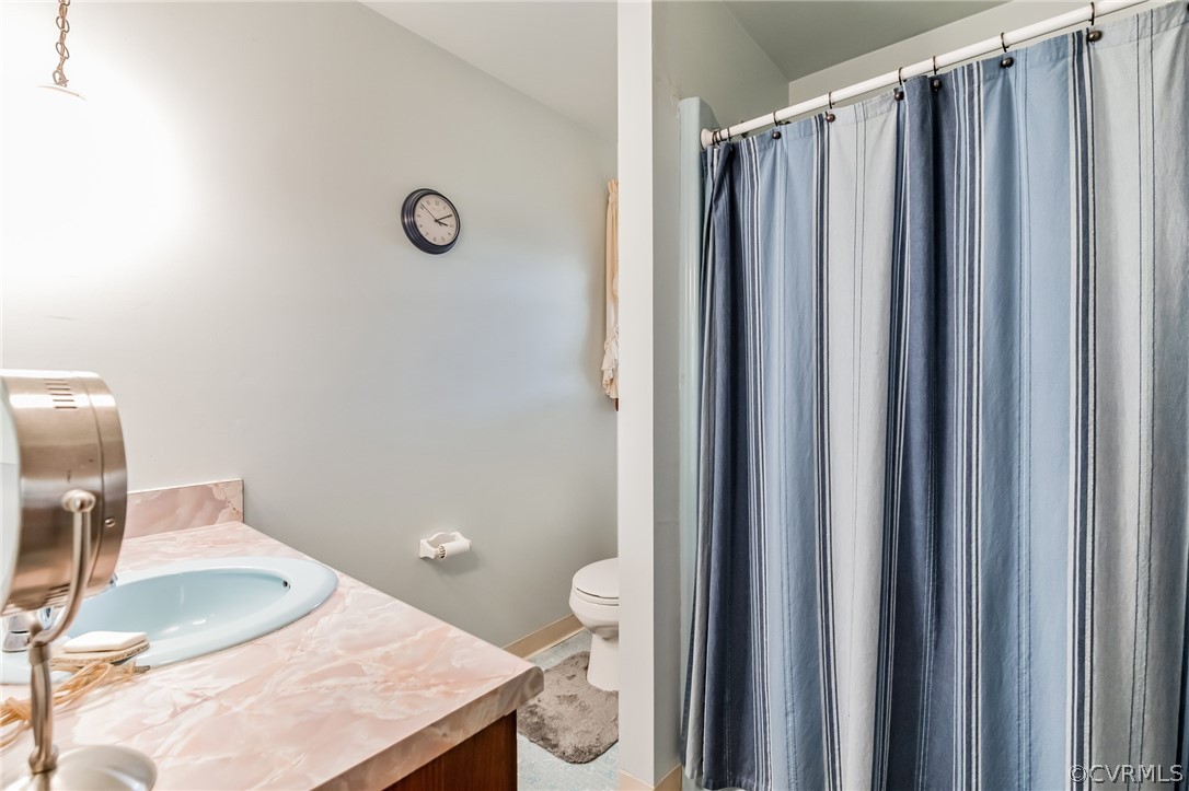 10411 Ambridge Road Chesterfield, VA 23832 - Photo 20 of 33 a bathroom with a granite countertop sink and a mirror