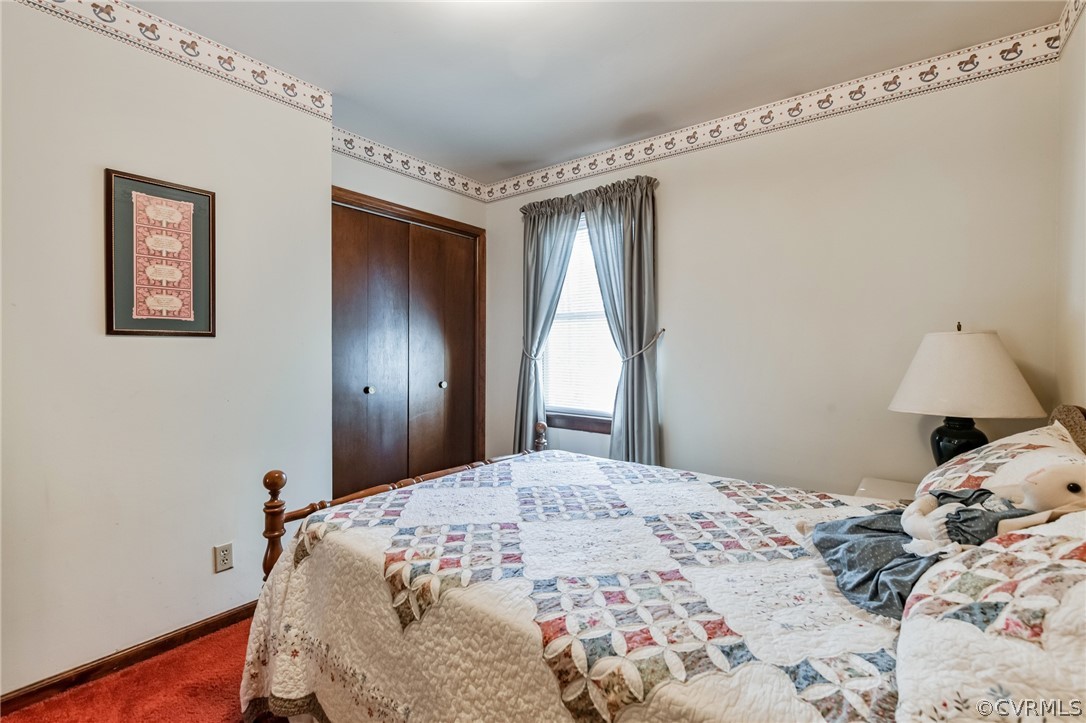 10411 Ambridge Road Chesterfield, VA 23832 - Photo 23 of 33 a bedroom with a bed and a window