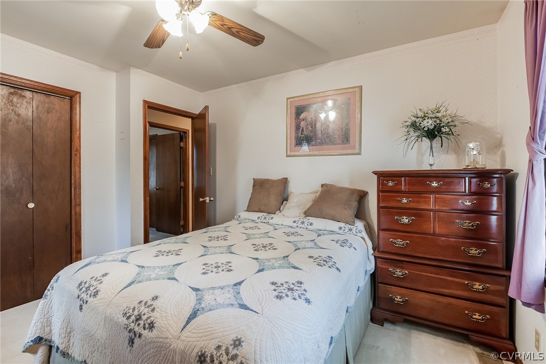 10411 Ambridge Road Chesterfield, VA 23832 - Photo 25 of 33 a bedroom with a bed and a dresser