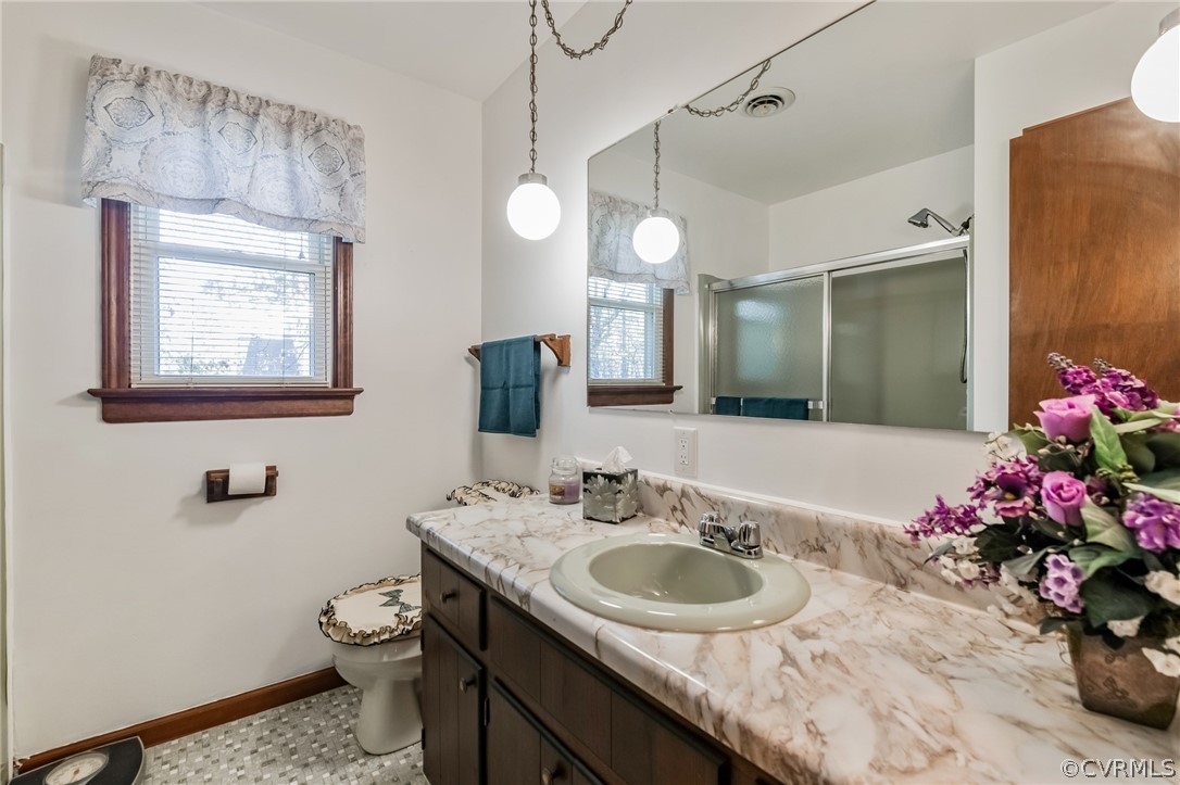 10411 Ambridge Road Chesterfield, VA 23832 - Photo 28 of 33 a bathroom with a sink and a mirror