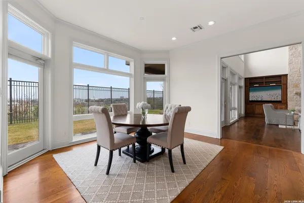 a view of a dining room with furniture and wooden floor