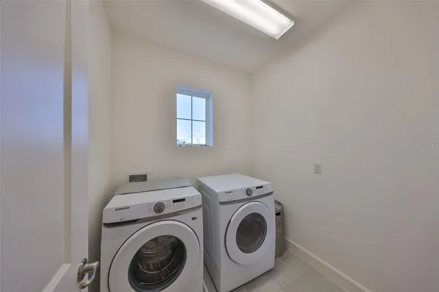 a bed room with a bed and a window