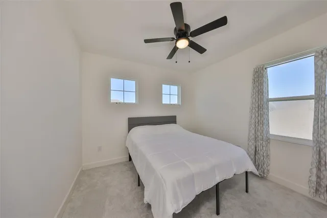 a view of empty room with ceiling fan