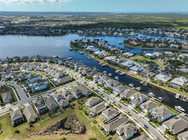 an aerial view of a city with ocean view