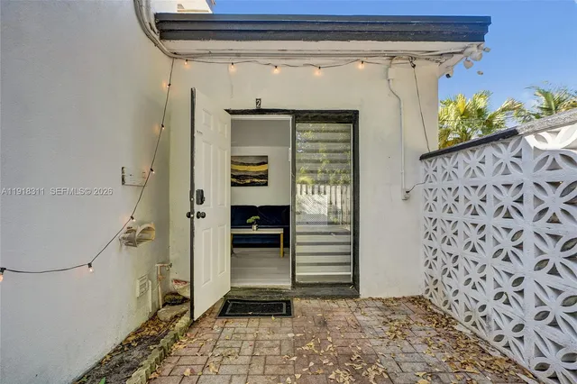 a front view of a house with a garden and yard