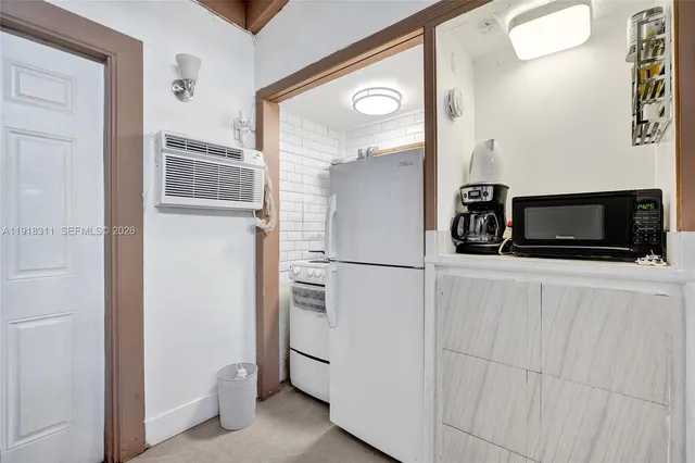 a bathroom with a sink vanity and a mirror