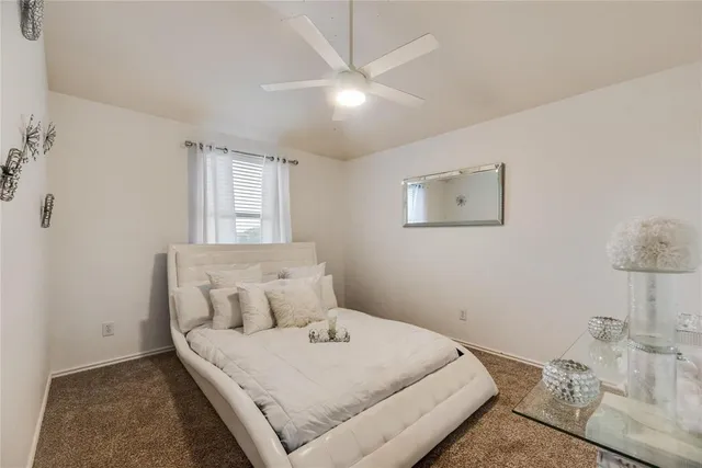 a bedroom with a bed and a table in it