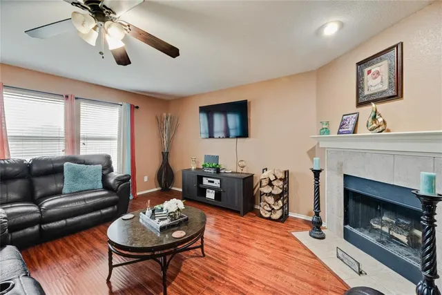 a living room with furniture and a fireplace