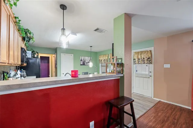 a room with furniture and wooden floor