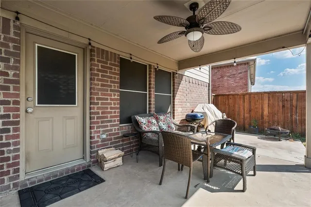 a work room with furniture and a window