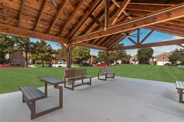 a view of a backyard with sitting area