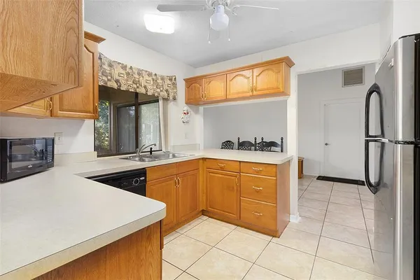 a kitchen with stainless steel appliances a sink and a refrigerator