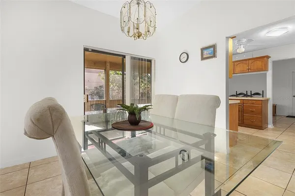 a living room with furniture chandelier and a table