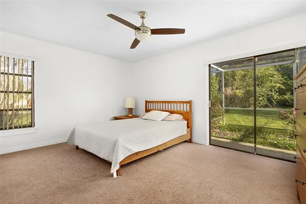 a bed sitting in a room next to a window
