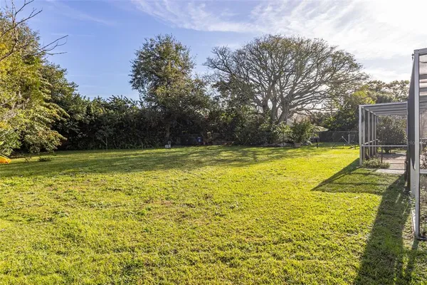 a view of a swimming pool with an outdoor space and seating area