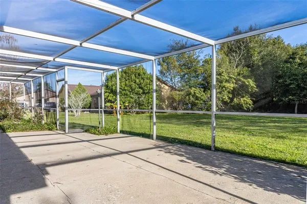a view of a house with backyard and porch