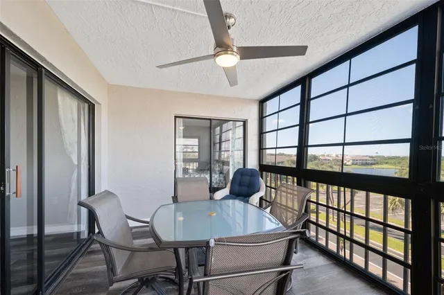 a view of swimming pool with outdoor seating and city view