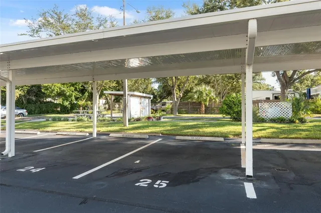 a room with lots of wooden furniture and a view of living room