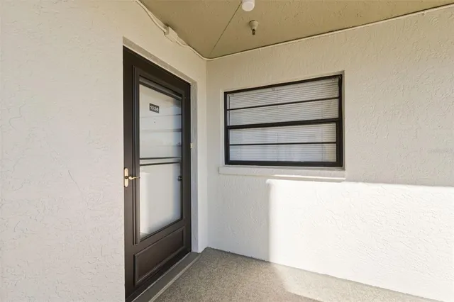 a kitchen with appliances a sink and cabinets