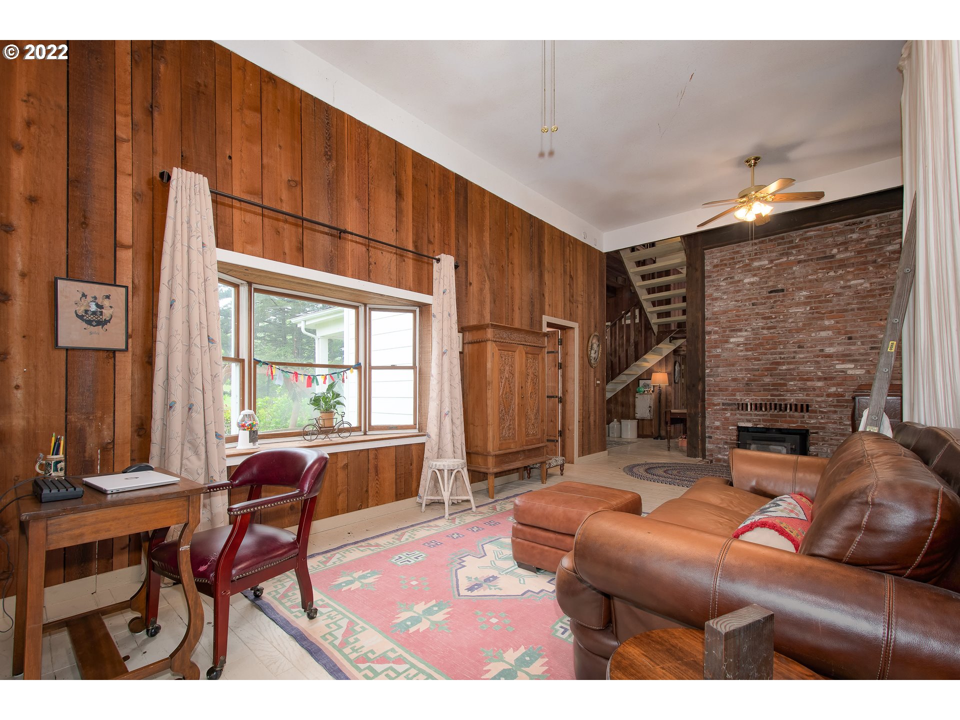 181 Marble Road Washougal, WA 98671 - Photo 12 of 32 a living room with furniture a fireplace and a table