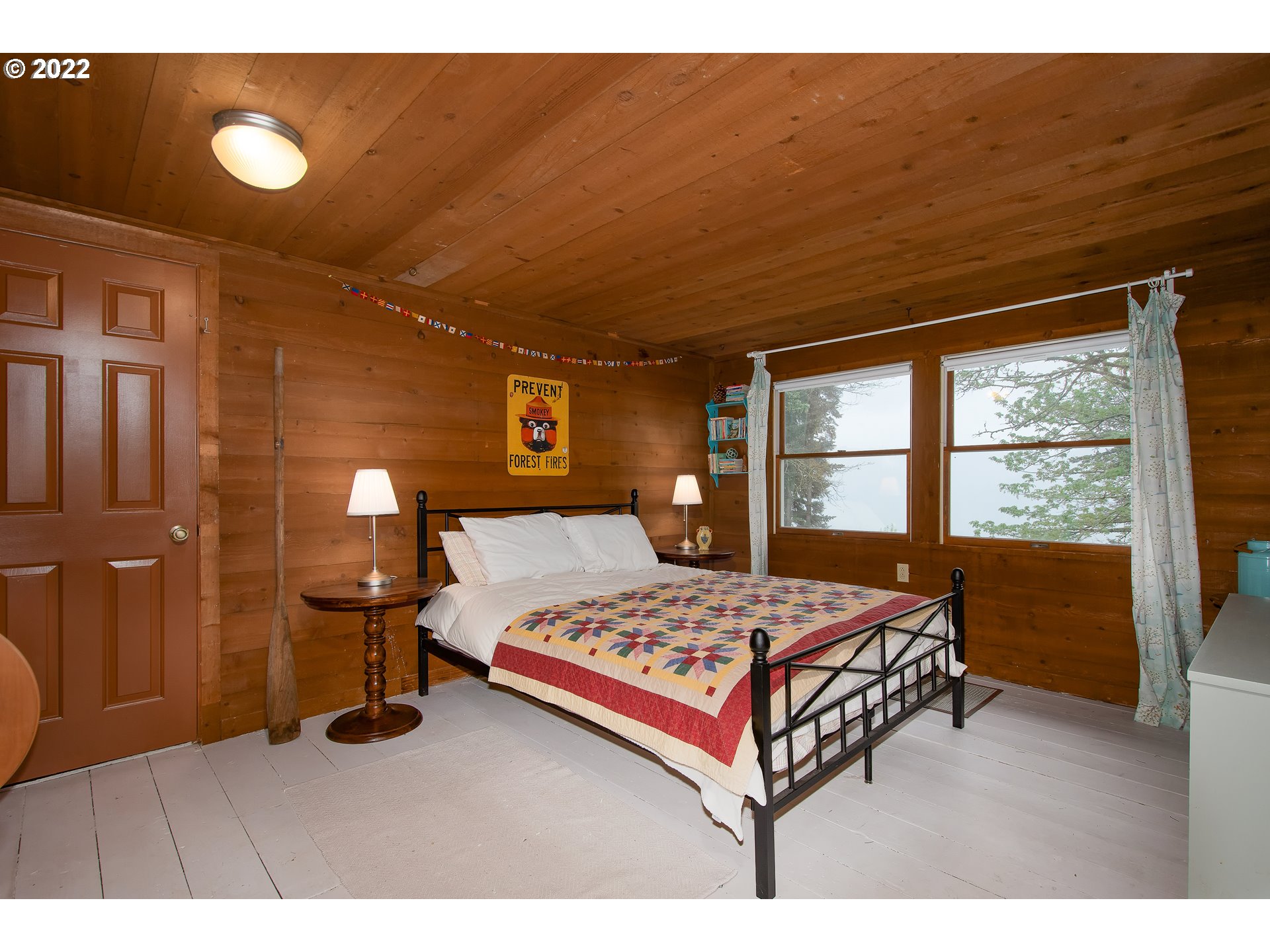 181 Marble Road Washougal, WA 98671 - Photo 14 of 32 a bedroom with a bed and wooden floor