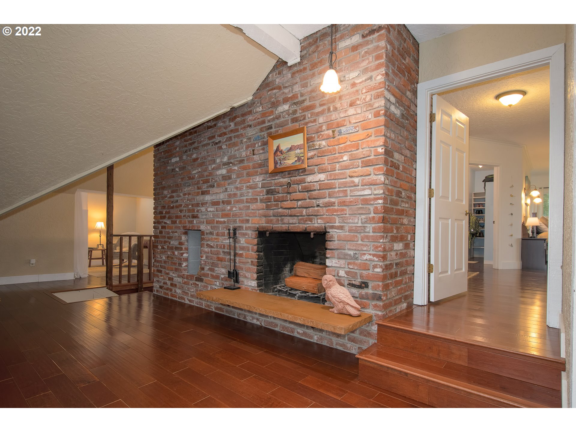 181 Marble Road Washougal, WA 98671 - Photo 16 of 32 a view of a livingroom with wooden floor and a fireplace